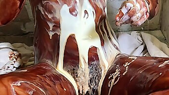 A Chocolate-Covered Babe Gets Her Feet And Pussy Creamed In A Steamy Video