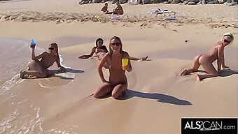 A Group Of Six Sexually Aroused Women Engage In Sexual Activity On A Public Beach.