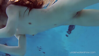 Red-Headed Vixen Roxalana Cheh In Sensual Underwater Encounter