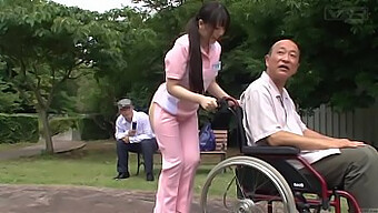 A Japanese Caregiver In Revealing Attire Engages In Unusual Activities Outdoors