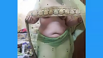 Indian Housewife Playfully Flaunts Her Curves In A Transparent Saree