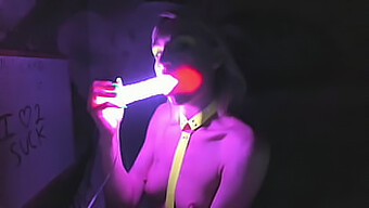 Kelly Copperfield Performs Intense Deepthroating On A Neon-Lit Dildo On Webcam